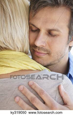 Couple embracing each other View Large Photo Image Stock Image - Couple embracing each other. Fotosearch