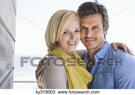 Portrait of a couple smiling View Large Photo Image Stock Image - Portrait of a couple smiling. Fotosearch