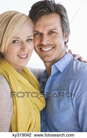 Portrait of a couple smiling View Large Photo Image Stock Image - Portrait of a couple smiling. Fotosearch