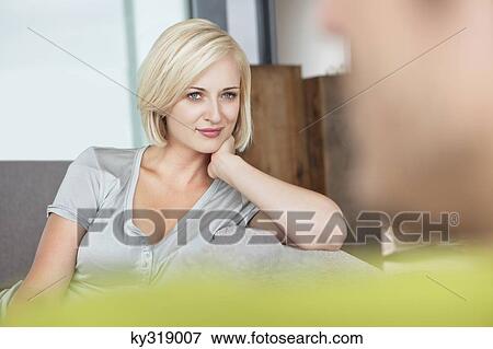 Woman looking at her husband View Large Photo Image Stock Photo - Woman looking at her husband. Fotosearch