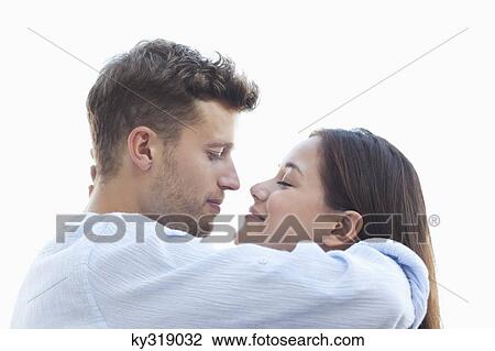 Young couple about to kiss each other View Large Photo Image Stock Image - Young couple about to kiss each other. Fotosearch