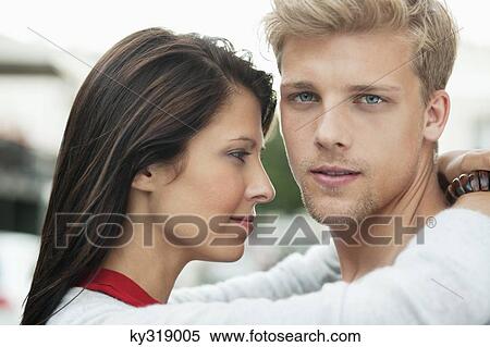 Stock Photography - Young couple embracing. Fotosearch