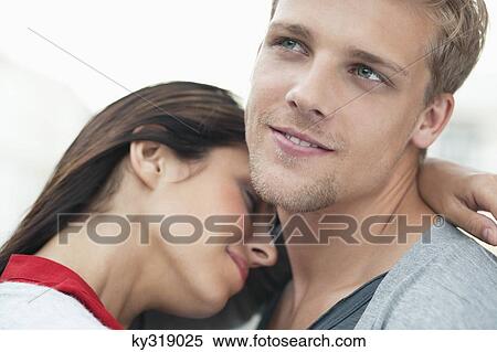 Stock Photography - Young couple embracing. Fotosearch