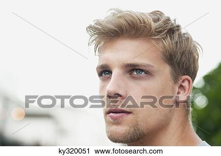 Close-up of a young man View Large Photo Image Stock Image - Close-up of a young man. Fotosearch