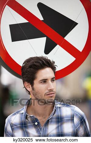 Handsome man thinking with no entry sign in the background View Large Photo Image Stock Photography - Handsome man thinking with no entry sign in the background. Fotosearch