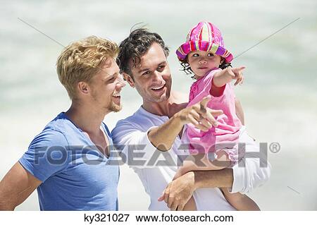 Man carrying his daughter pointing View Large Photo Image Stock Photo - Man carrying his daughter pointing. Fotosearch