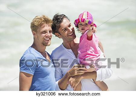 Stock Photograph - Man carrying his daughter pointing. Fotosearch