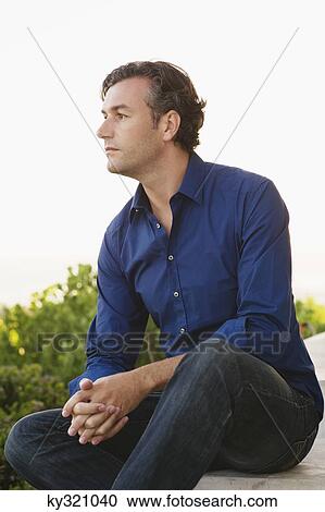 Mid adult man thinking View Large Photo Image Stock Image - Mid adult man thinking. Fotosearch
