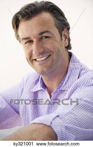 Portrait of a mid adult man smiling View Large Photo Image Stock Image - Portrait of a mid adult man smiling. Fotosearch