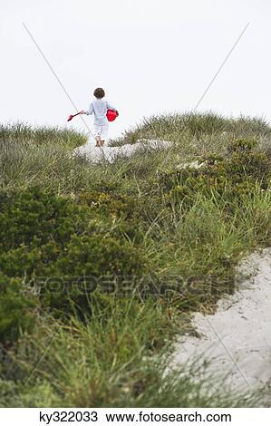 Boy running on the beach View Large Photo Image Stock Image - Boy running on the beach. Fotosearch