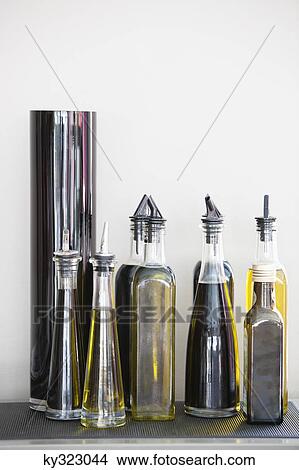 Picture - Assorted cooking oil bottles in a restaurant. Fotosearch