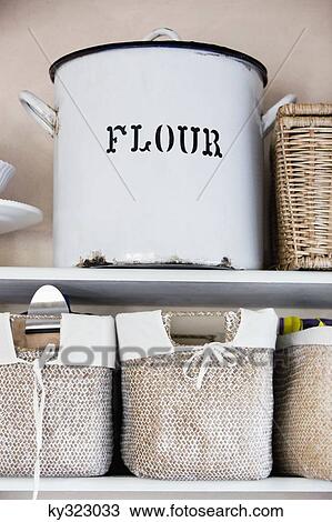 Stock Image - Close-up of a flour container. Fotosearch