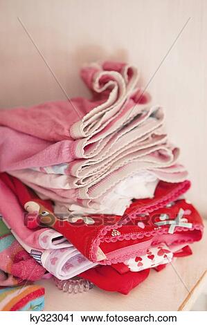 Stock Image - Close-up of folded clothes. Fotosearch