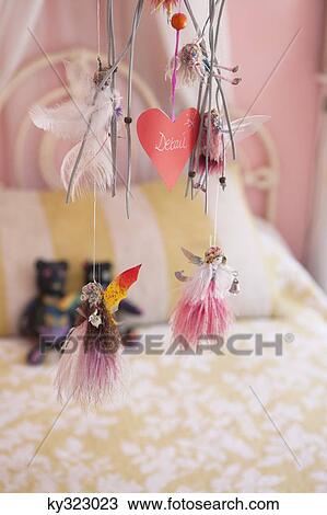 Close-up of wind chime decorated in a bedroom View Large Photo Image Stock Image - Close-up of wind chime decorated in a bedroom. Fotosearch