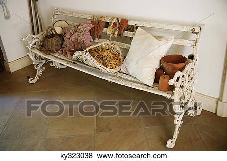 Leaves with flowers and basket on a bench View Large Photo Image Stock Photo - Leaves with flowers and basket on a bench. Fotosearch