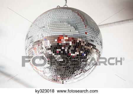 Low angle view of a mirrored disco ball in a nightclub View Large Photo Image Stock Photo - Low angle view of a mirrored disco ball in a nightclub. Fotosearch