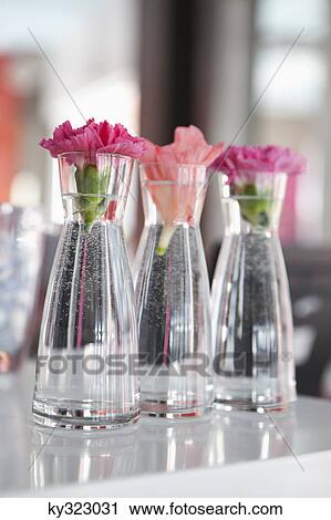 Stock Image - Vase placed in a row at a restaurant. Fotosearch