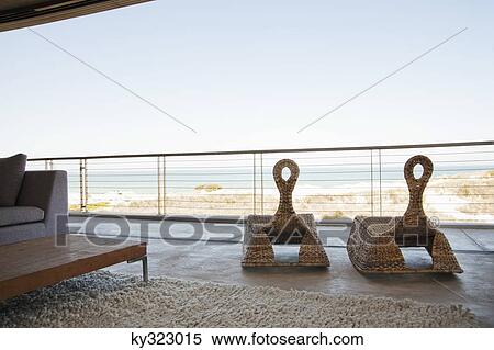 View of beach seen through balcony View Large Photo Image Stock Photography - View of beach seen through balcony. Fotosearch