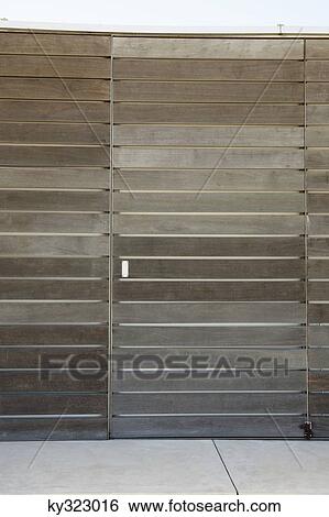 Stock Photograph - View of closed wood paneled door. Fotosearch