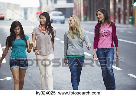 Beautiful women walking on the road View Large Photo Image Stock Photography - Beautiful women walking on the road. Fotosearch