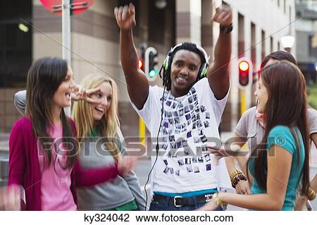 Friends dancing on the road View Large Photo Image Stock Image - Friends dancing on the road. Fotosearch