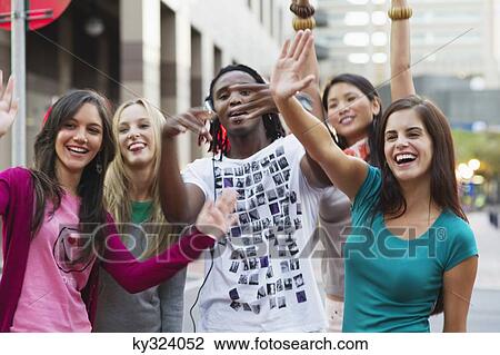 Friends dancing on the road View Large Photo Image Stock Image - Friends dancing on the road. Fotosearch