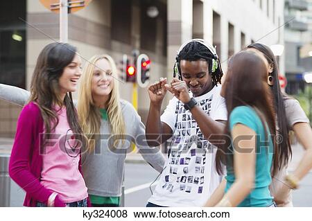Friends dancing on the road View Large Photo Image Stock Photo - Friends dancing on the road. Fotosearch