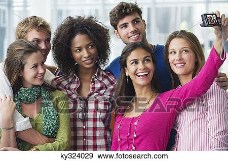 Multi-ethnic university students taking photos of themselves View Large Photo Image Stock Photo - Multi-ethnic university students taking photos of themselves. Fotosearch