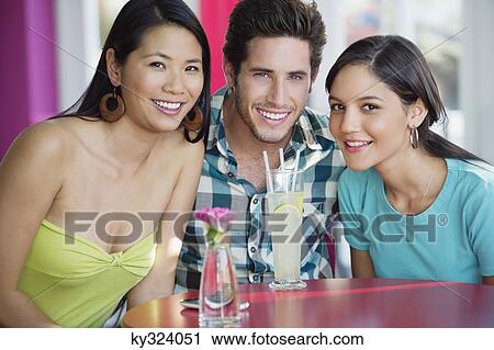 Portrait of a man and women with lime juice on table in a restaurant View Large Photo Image Stock Image - Portrait of a man and women with lime juice on table in a restaurant. Fotosearch