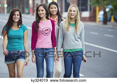 Portrait of beautiful women walking on the road View Large Photo Image Stock Photo - Portrait of beautiful women walking on the road. Fotosearch