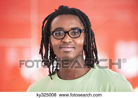 Portrait of a smiling man wearing eyeglasses View Large Photo Image Stock Photo - Portrait of a smiling man wearing eyeglasses. Fotosearch
