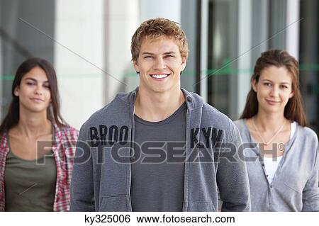 Portrait of three friends smiling in a campus View Large Photo Image Stock Photograph - Portrait of three friends smiling in a campus. Fotosearch