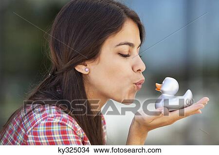 Woman kissing rubber duck View Large Photo Image Picture - Woman kissing rubber duck. Fotosearch