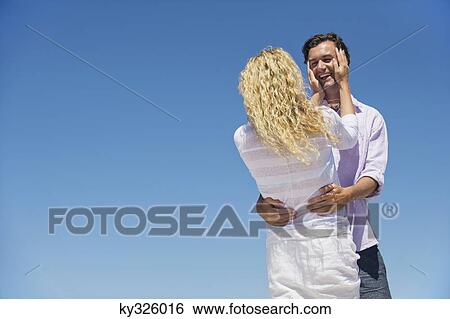 Stock Photograph - Couple embracing each other. Fotosearch