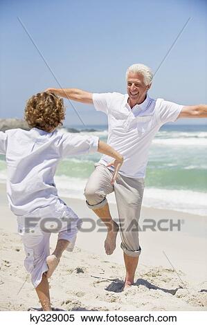 Stock Photography - Senior man teaching martial arts to his grandson. Fotosearch