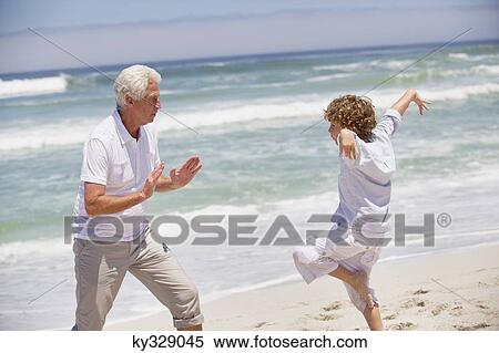 Senior man teaching martial arts to his grandson View Large Photo Image Stock Photography - Senior man teaching martial arts to his grandson. Fotosearch