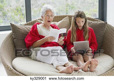 Senior woman and her granddaughter looking surprised View Large Photo Image Stock Image - Senior woman and her granddaughter looking surprised. Fotosearch