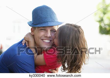 Cute little girl hugging her father View Large Photo Image Stock Image - Cute little girl hugging her father. Fotosearch