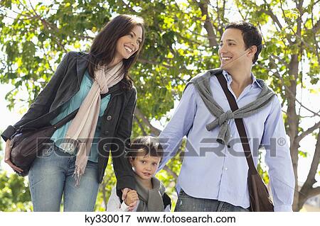 Family walking together on the road View Large Photo Image Stock Photo - Family walking together on the road. Fotosearch