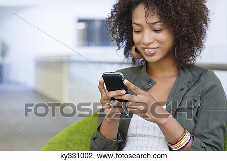 African American woman using mobile phone in university View Large Photo Image Stock Image - African American woman using mobile phone in university. Fotosearch