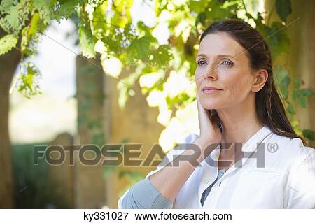 Beautiful mature woman day dreaming View Large Photo Image Stock Photo - Beautiful mature woman day dreaming. Fotosearch