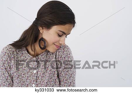 Beautiful woman with her eyes closed against white background View Large Photo Image Stock Image - Beautiful woman with her eyes closed against white background. Fotosearch