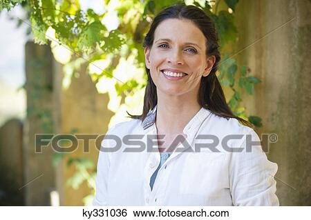 Stock Photograph - Portrait of a beautiful mature woman smiling. Fotosearch