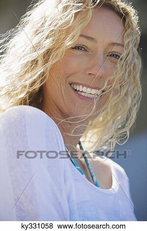 Portrait of a beautiful woman smiling View Large Photo Image Stock Photo - Portrait of a beautiful woman smiling. Fotosearch