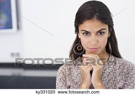 Portrait of a beautiful woman with hand on chin View Large Photo Image Stock Image - Portrait of a beautiful woman with hand on chin. Fotosearch