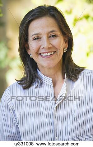 Portrait of a senior woman smiling View Large Photo Image Stock Photo - Portrait of a senior woman smiling. Fotosearch