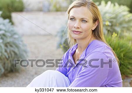 Young woman thinking View Large Photo Image Stock Photo - Young woman thinking. Fotosearch