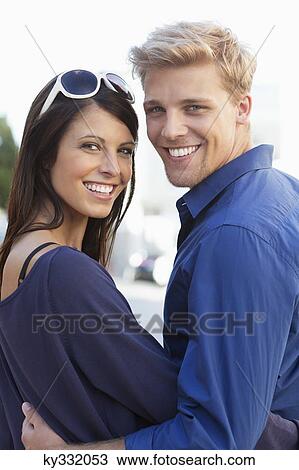 Portrait of a young couple smiling View Large Photo Image Stock Image - Portrait of a young couple smiling. Fotosearch