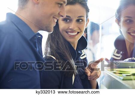 Young couple doing window shopping View Large Photo Image Stock Image - Young couple doing window shopping. Fotosearch