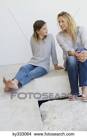 Picture - Mother communicating with her daughter at home. Fotosearch